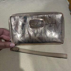 Metallic pink Michael Kors wristlet wallet